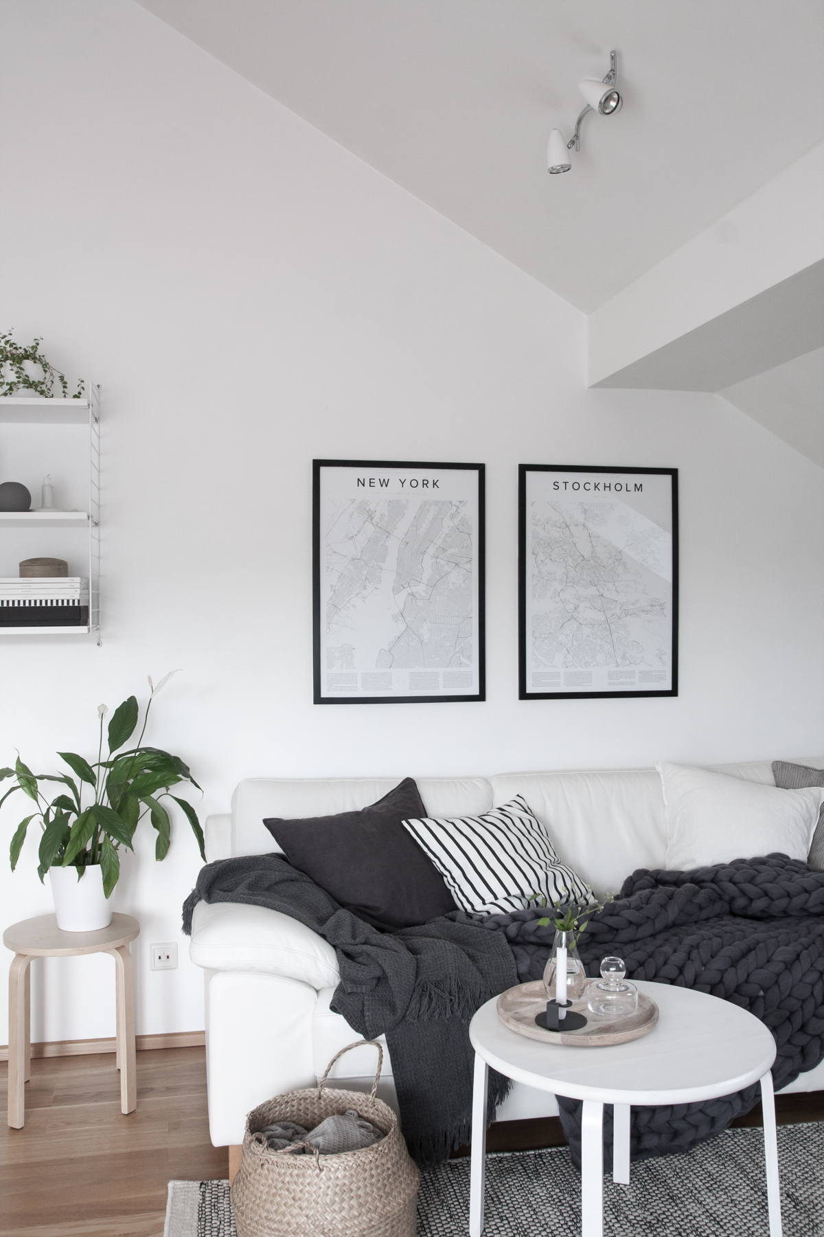 Monochrome-and-cozy-nordic-living-room.-Encyclopaedia-Urbana-posters.-Styling-and-photography-by-Anu-Tammiste-for-Decordots
